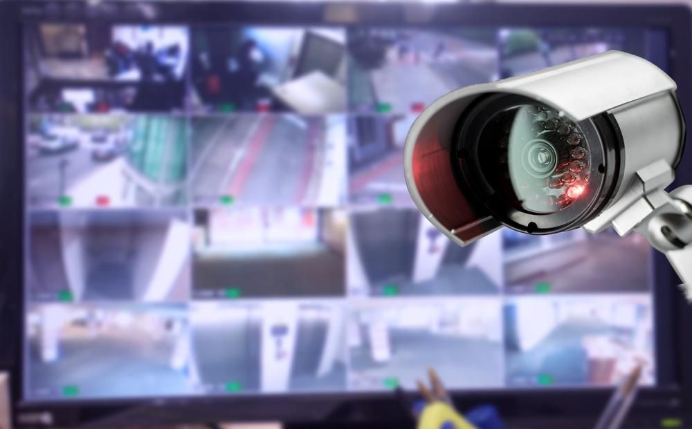 A Security Camera is Sitting in Front of a Computer Monitor — River City Communications In Nabiac, NSW