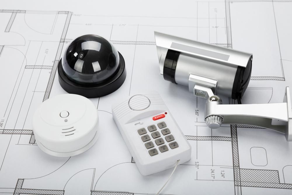 A Security System is Sitting on Top of a Blueprint — River City Communications In Forster, NSW