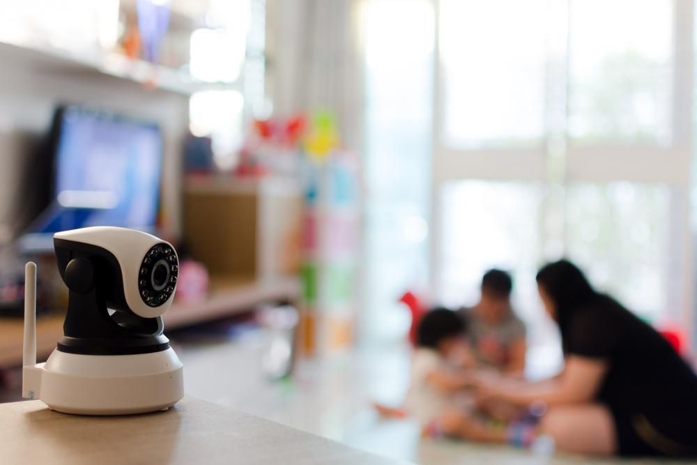 A Baby Monitor is Sitting on a Table in a Living Room — River City Communications In Forster, NSW