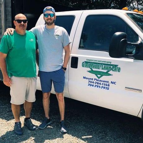 Owner and son in front of truck