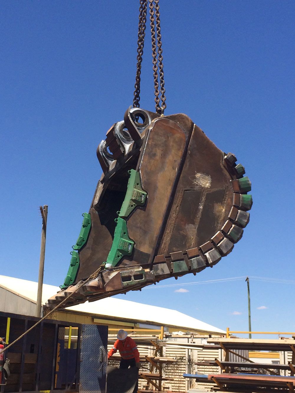 Men Workers Lifting Up The Big Bucket — Wright's Welding Operations In Cloncurry, QLD