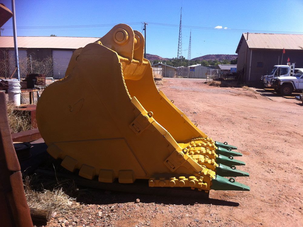 New Yellow Paint Bucket Display — Wright's Welding Operations In Boulia, QLD