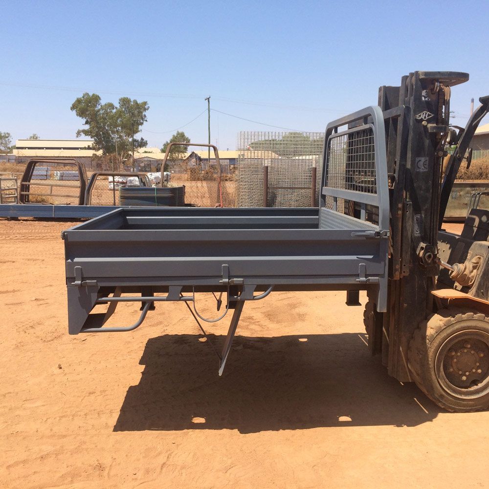 Trailer Trays Lifting Up Using Forklift Equipment — Wright's Welding Operations In Camooweal, QLD