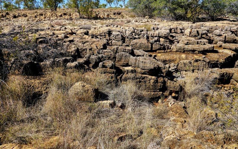 Dry Grass And Rocky Caves At Camooweal — Wright's Welding Operations In Camooweal, QLD