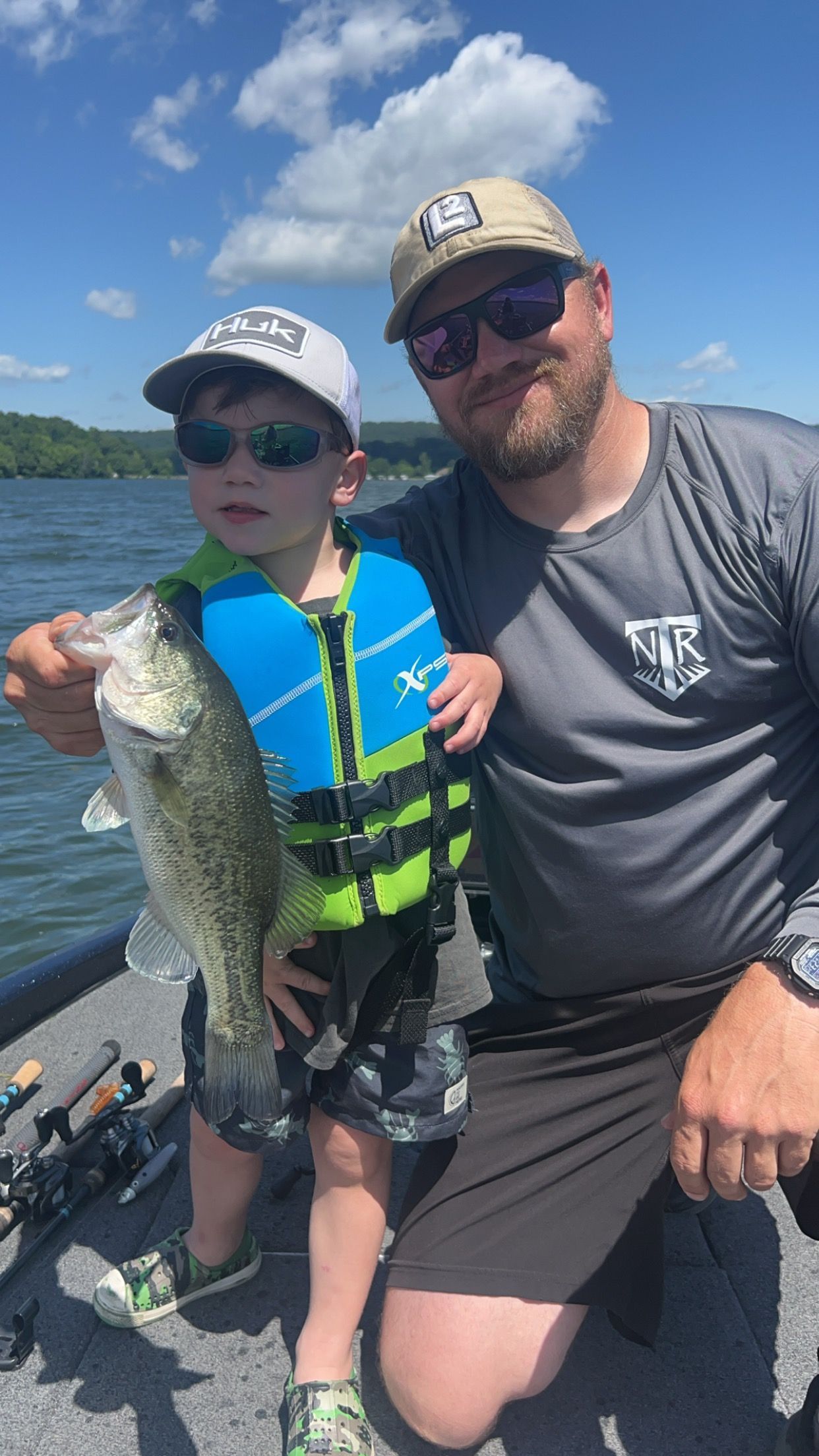 kid holding a nice bass