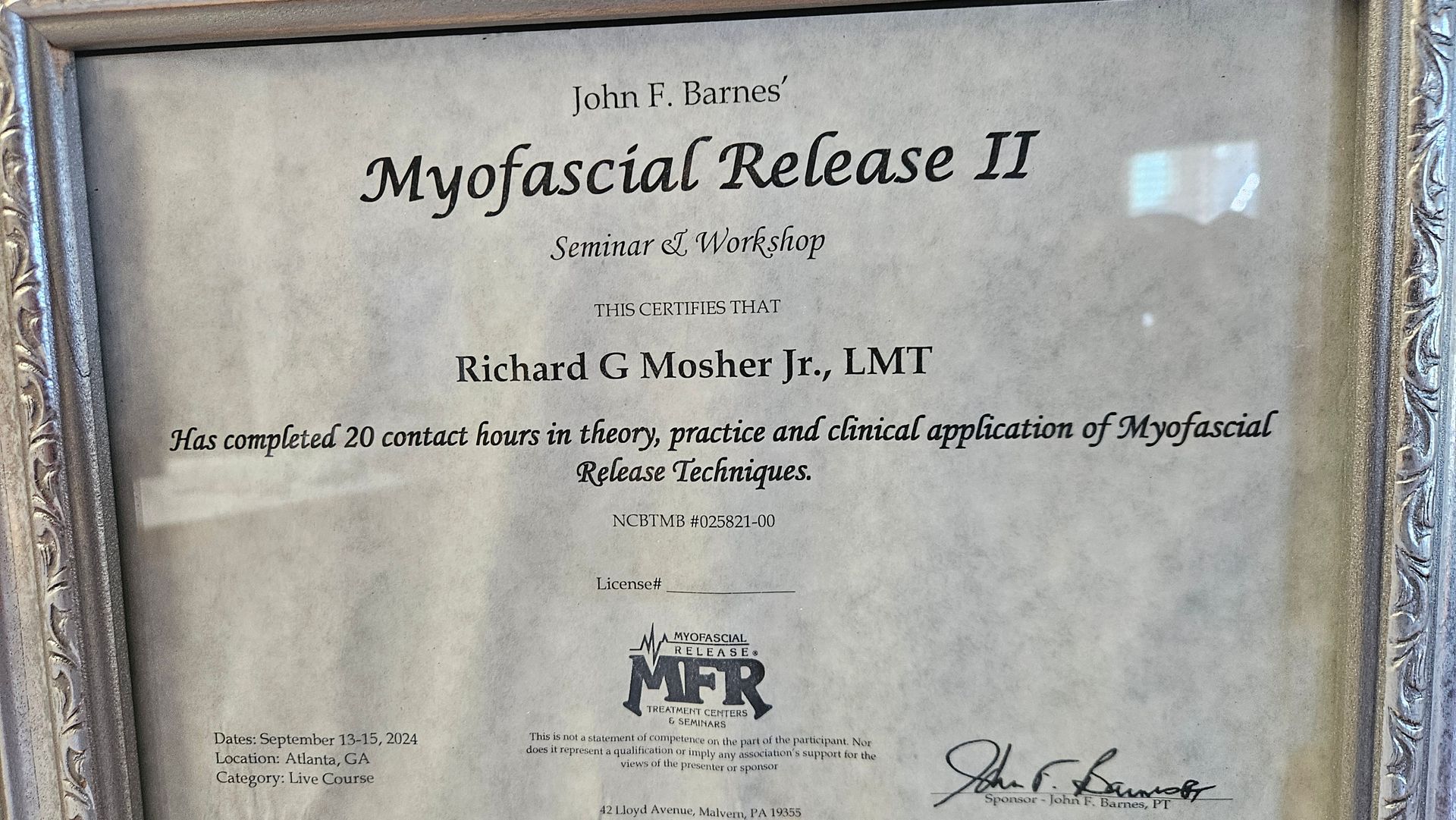 Framed certificate titled “Myofascial Release II” on a wall, with signatures and seal.