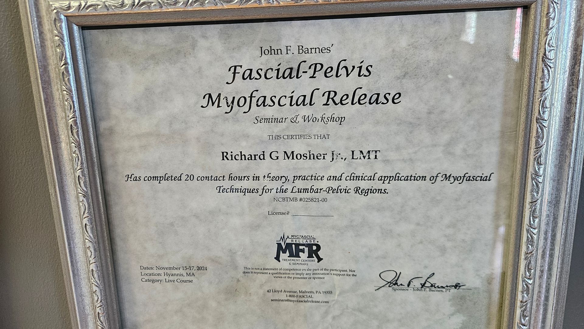 Framed medical certificate for “Myofascial Release,” with black text on a cream background.