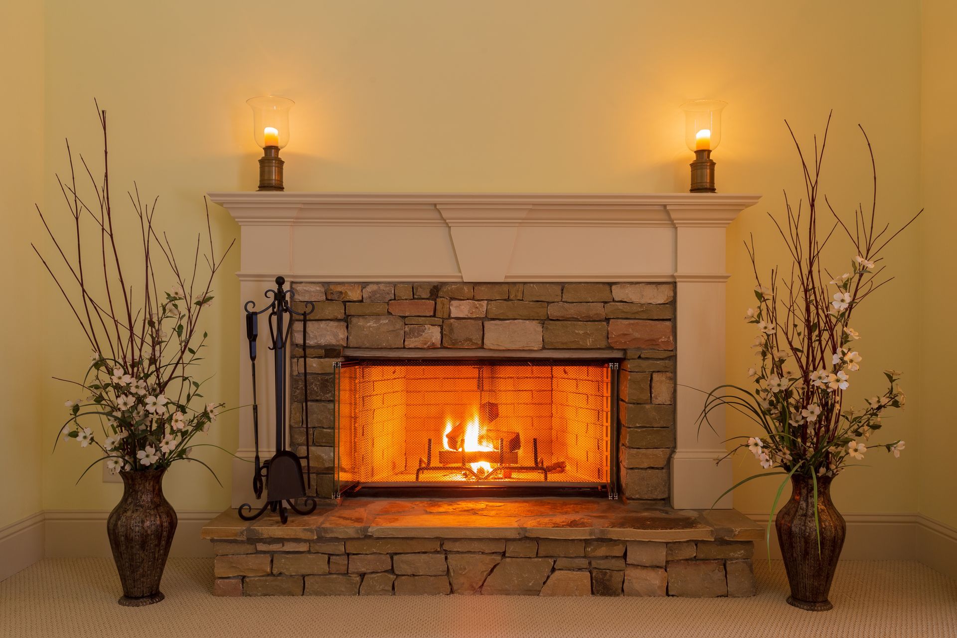 Gas fireplace with seasonal maintenance tools nearby Gas fireplace with seasonal maintenance tools nearby