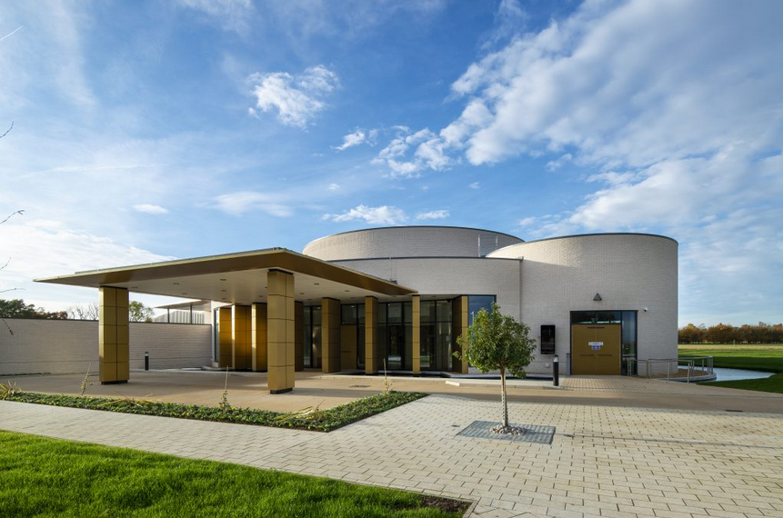 A large white building with a tree in front of it