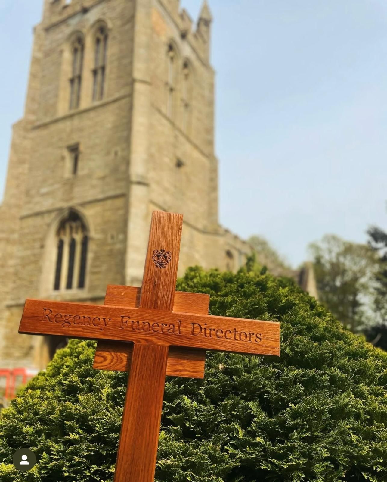 A wooden cross with the word directors on it