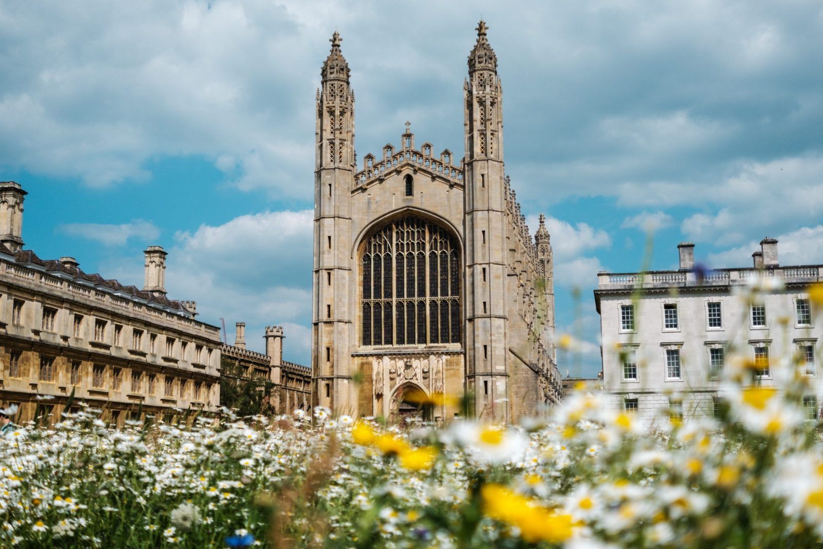 A large building with flowers in front of it
