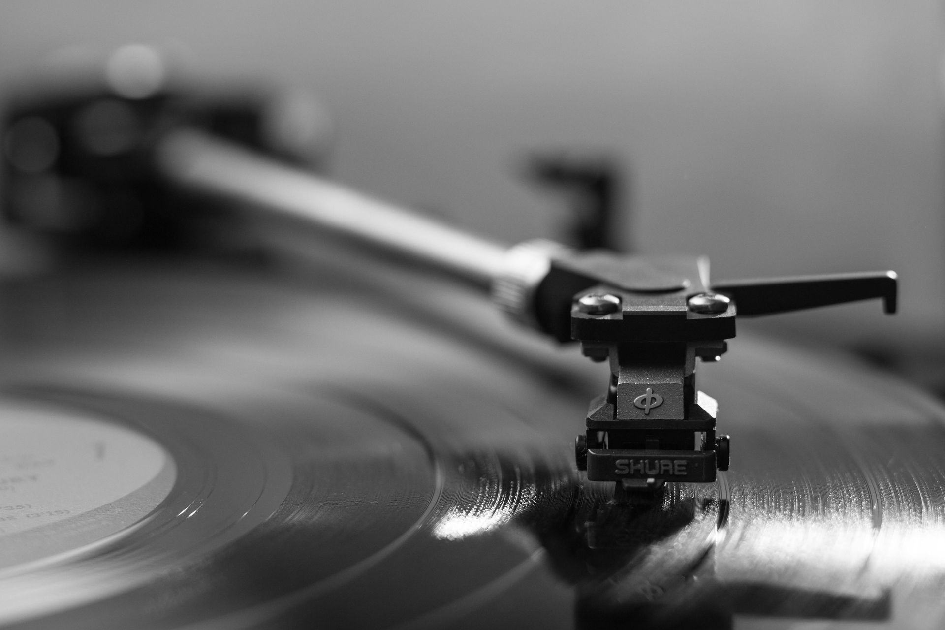 A shure record player is playing a record