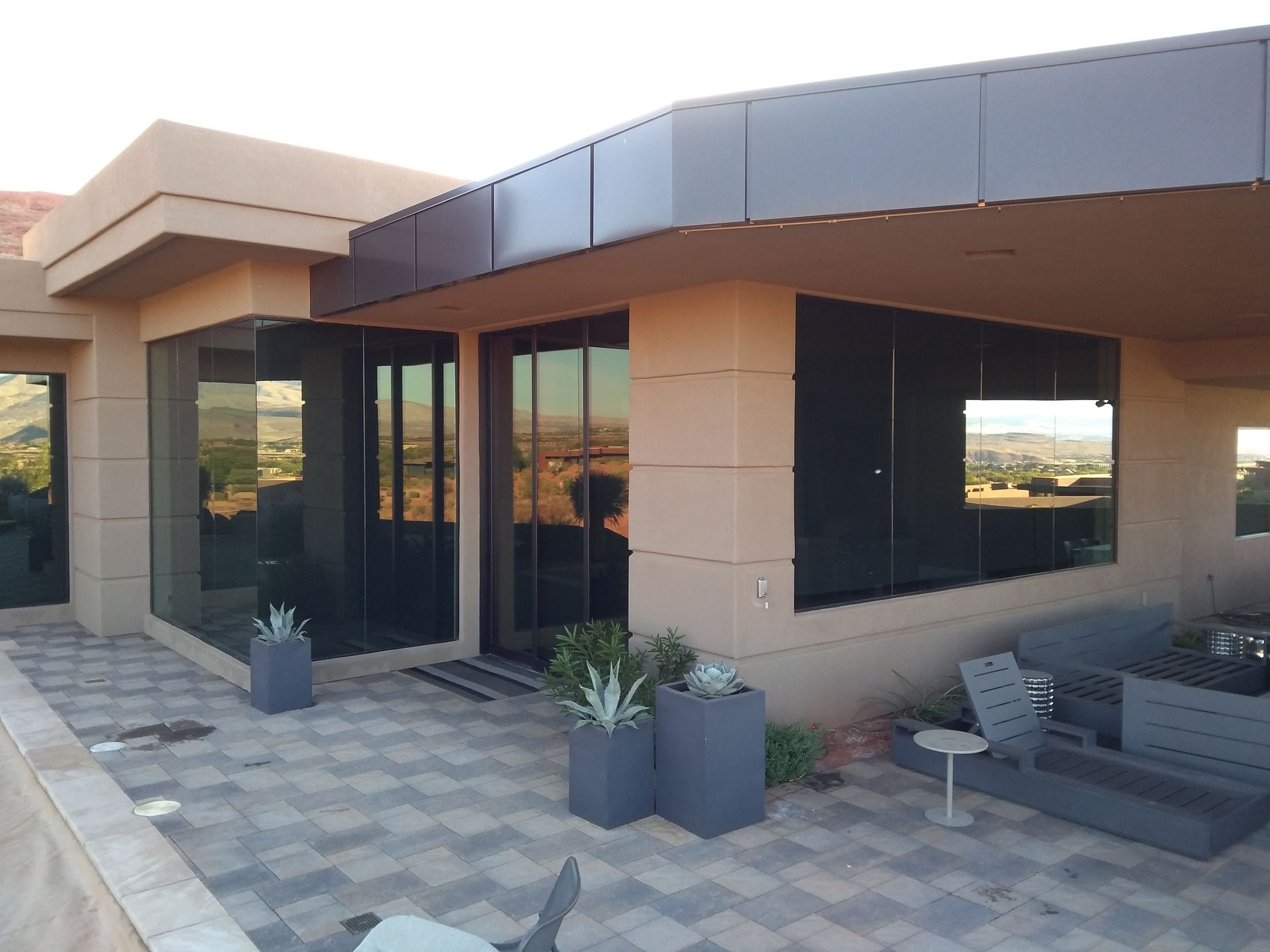 Recently cleaned windows by Closing Cleaners with the scenery reflected in the floor to ceiling windows.