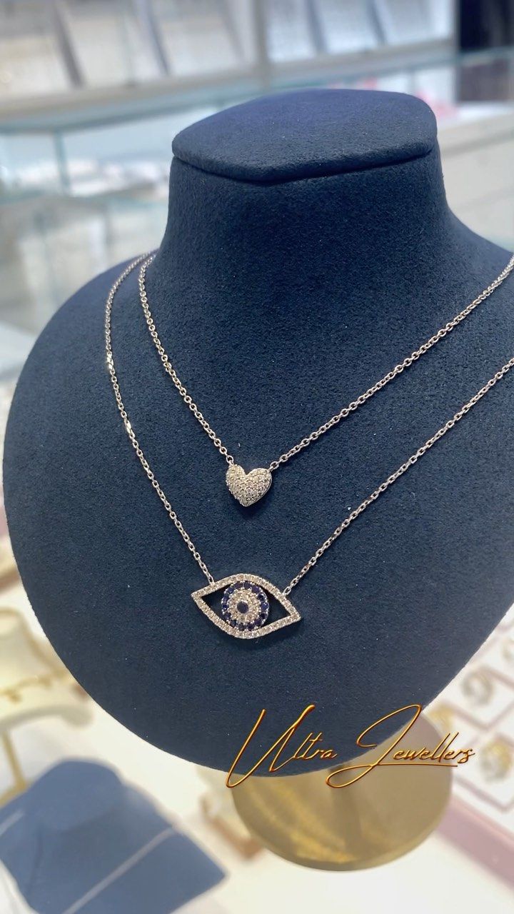 A close up of a necklace on a mannequin.