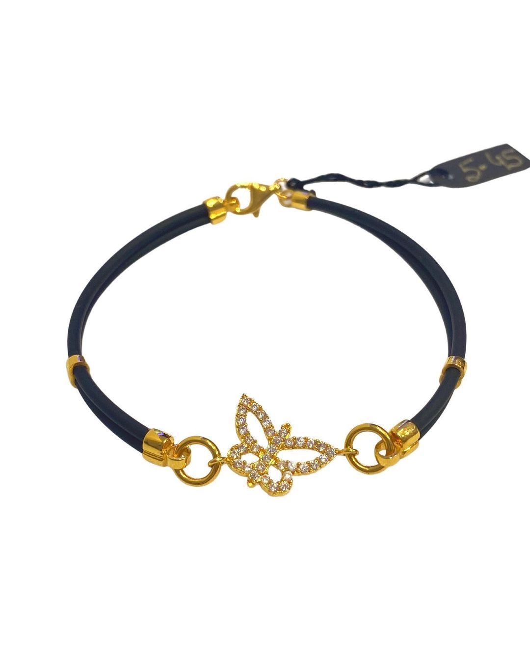 A black bracelet with a gold butterfly on it