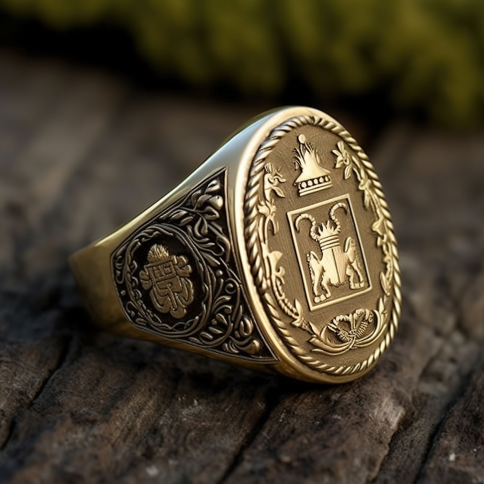 Gold signet ring with engraved crest, resting on weathered wood
