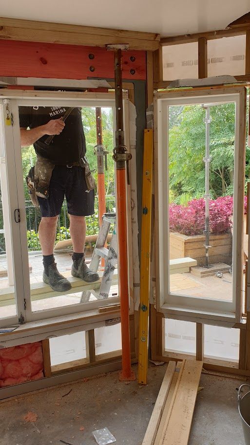 Interior framing with exposed timber studs during renovation