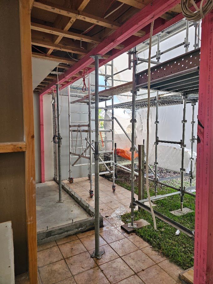 Interior structural steel beam framing with scaffolding