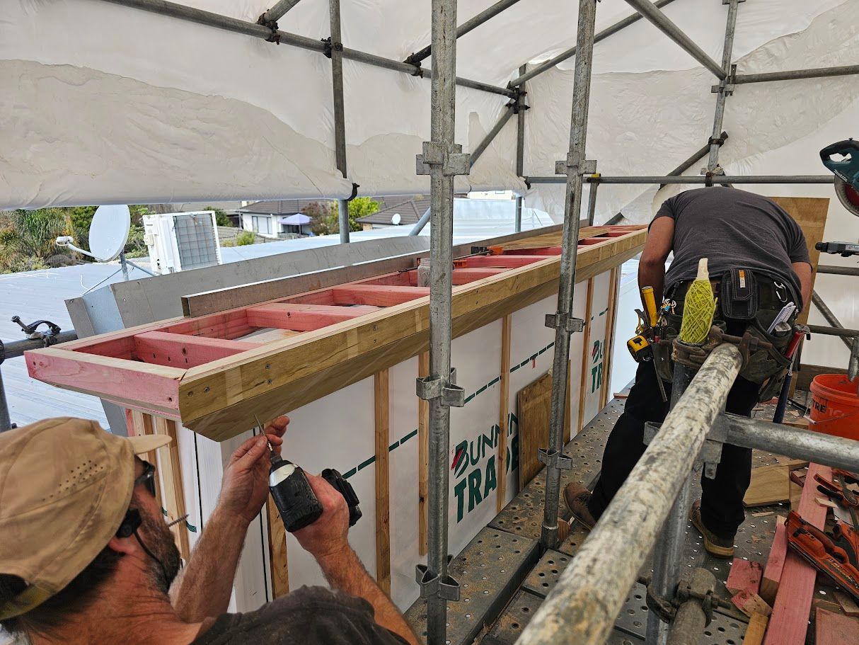 Man working on a roof edge from scaffolding