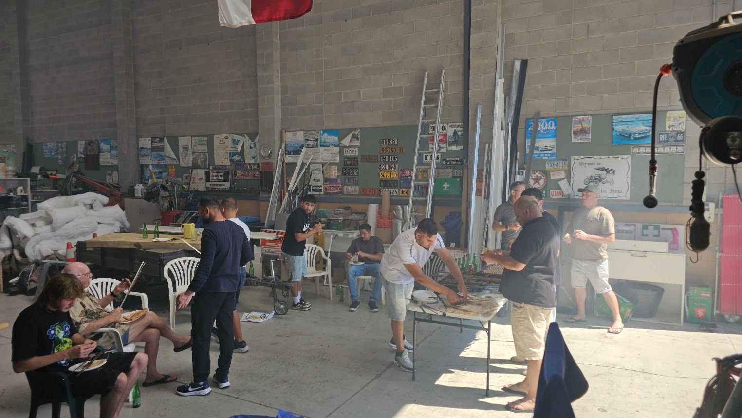 People working in a warehouse workshop