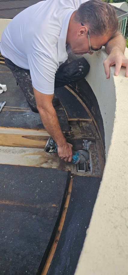 Man bending over while working outdoors