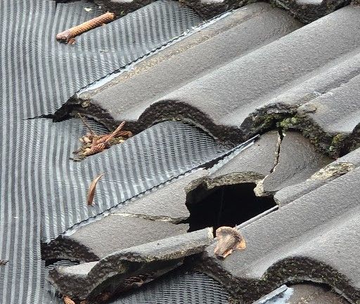 Damage roofing tile