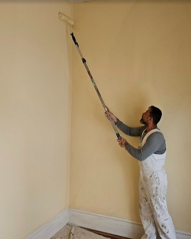 Painter rolling walls