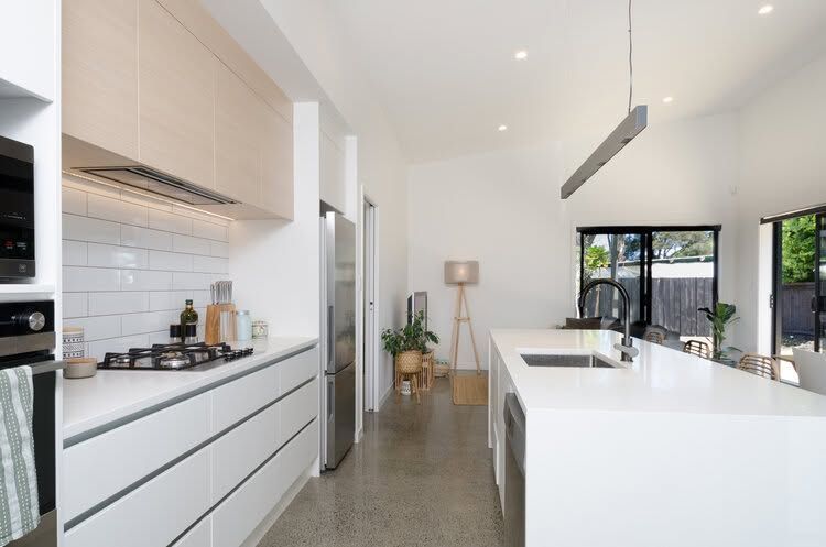   Clean slick white kitchen
