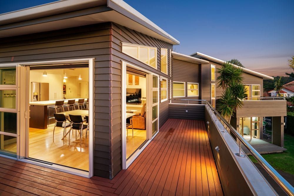 Weatherboard house deck evening lighting
