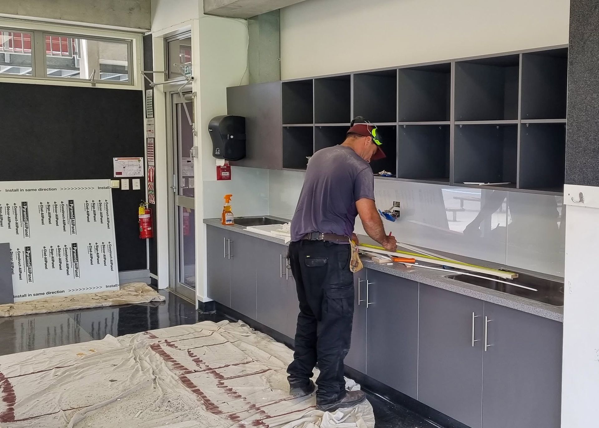 Man working school art room construction
