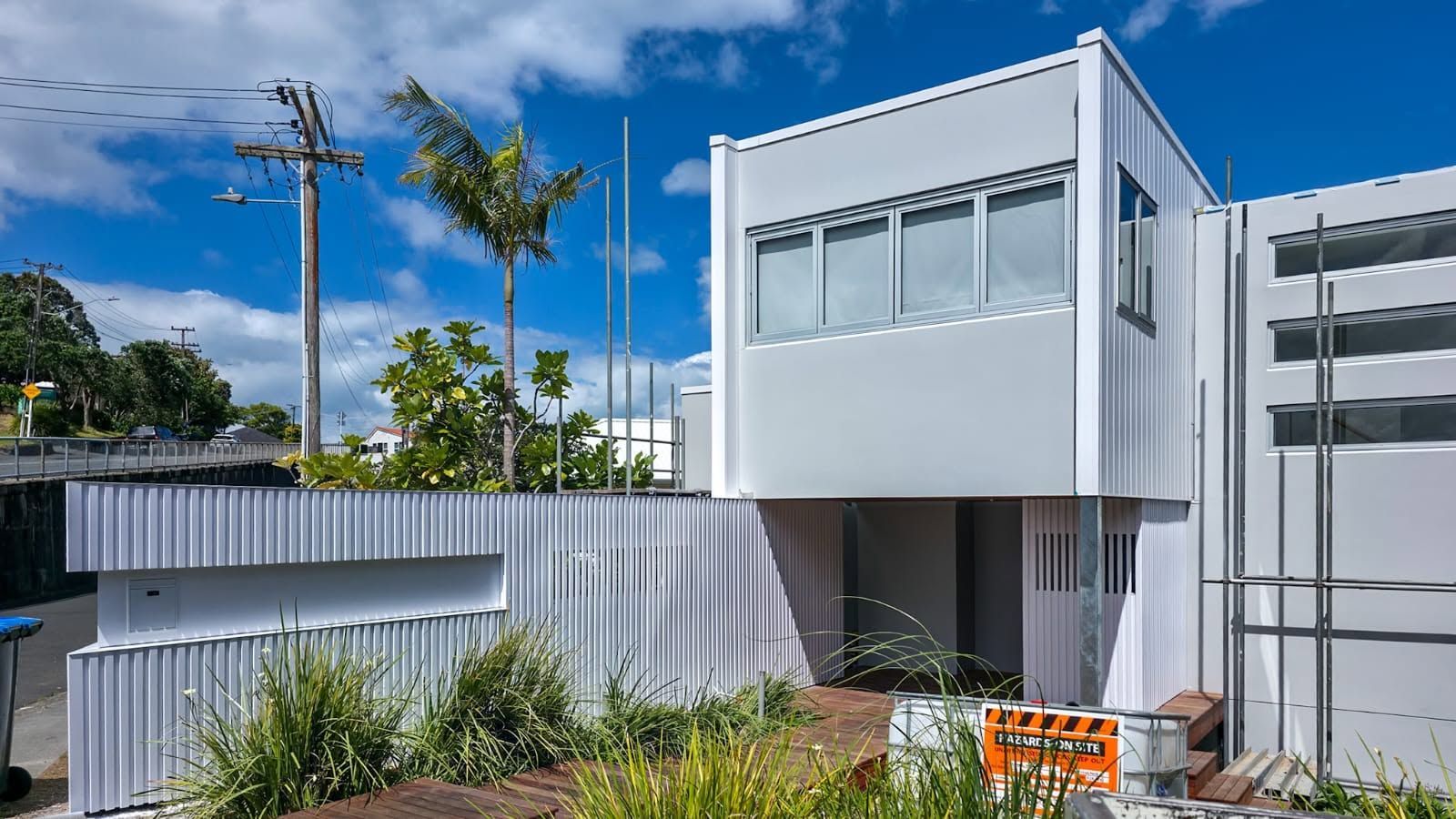 Modern building exterior with landscaping, alternate view