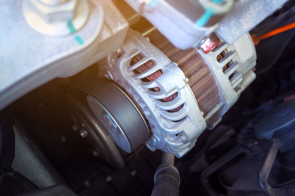 A Close Up of a Car Alternator Under the Hood of a Car — Auto Electrical Solutions In Pialba, QLD