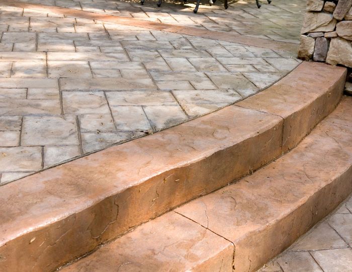 Concrete Backyard patio in halifax with table and chairs