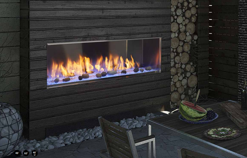 Monessen Hearth Lorider Modern outdoor patio with a glass-front fireplace and burning flames against dark stone walls