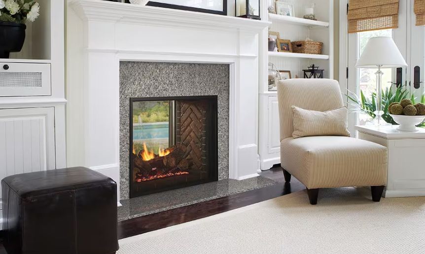Fireplace with stone surround, lit flames, wooden mantel, and TV above. Fireplace with stone surround, lit flames, wooden mantel, and TV above.