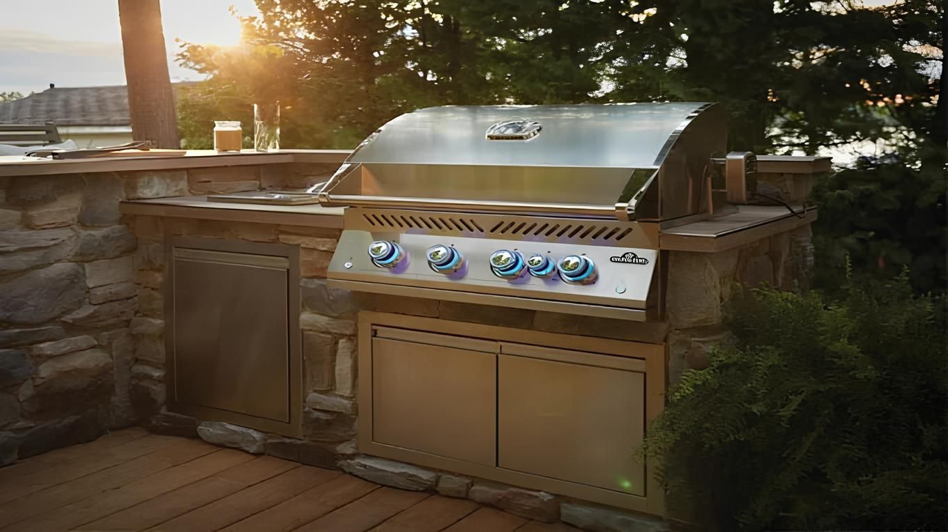 Built-in stainless steel BBQ grill in a stone outdoor kitchen