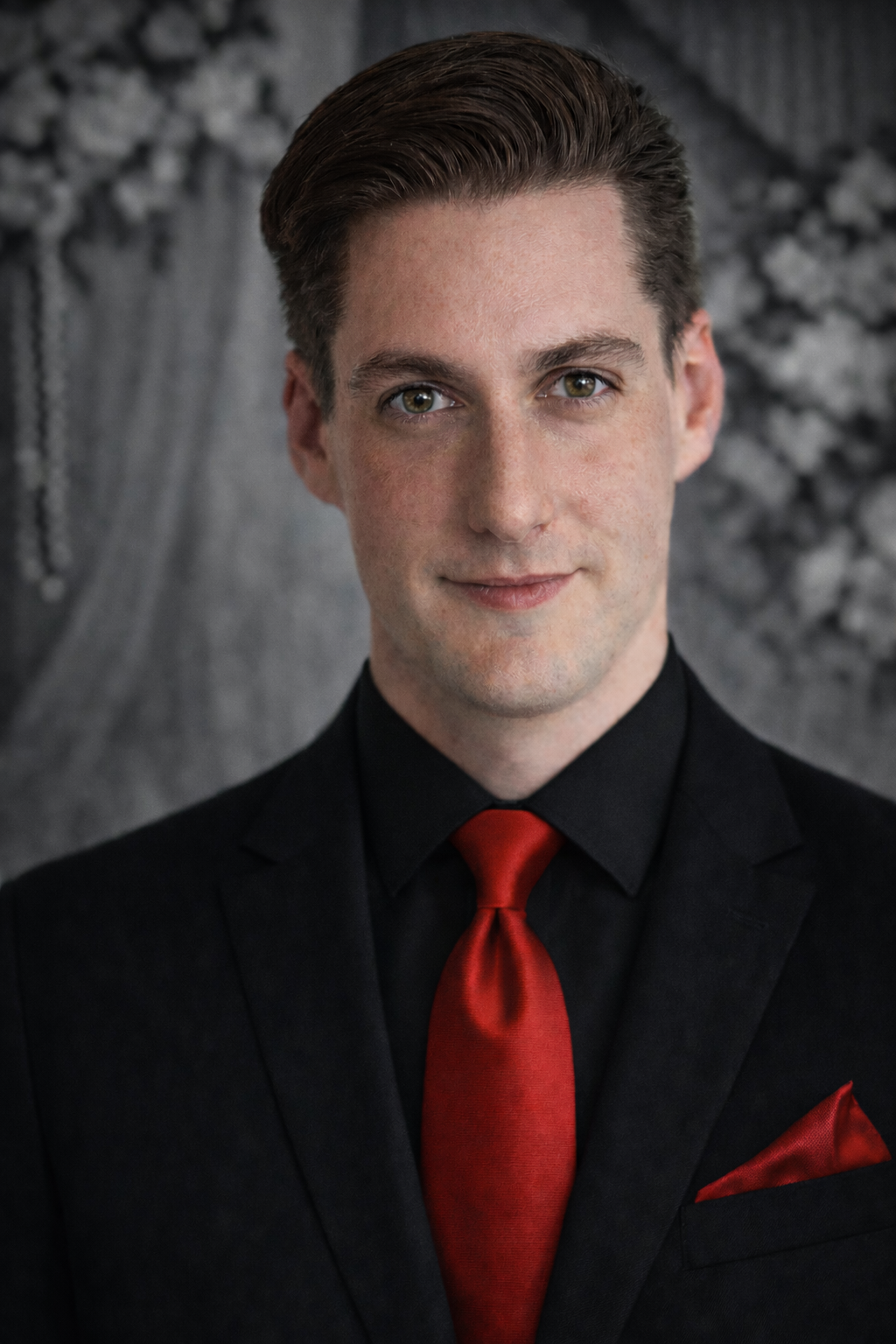 A man in a suit and tie is standing in front of a sign that says happily ever after starts here.