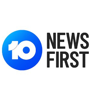 A blue circle with the words `` news first '' written inside of it.
