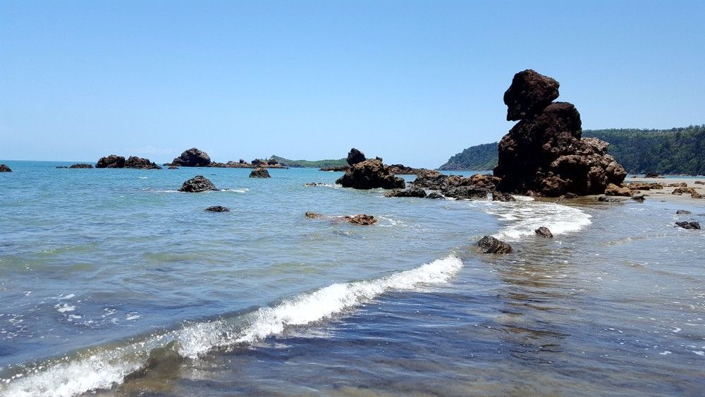 There Is A Large Rock In The Middle Of The Ocean — Blue Dog Hire Qld In Mackay, QLD