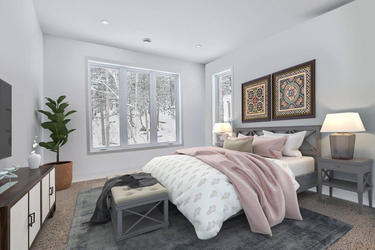 Chambre avec lit, table de chevet et fenêtre donnant sur un paysage enneigé. Décorée avec des œuvres d'art, une plante et un banc.