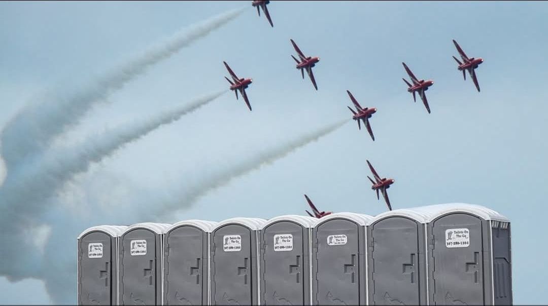 A Group of Planes are Flying Over a Row of Portable Toilets | Cheyenne, WY | Toilets On The Go, LLC