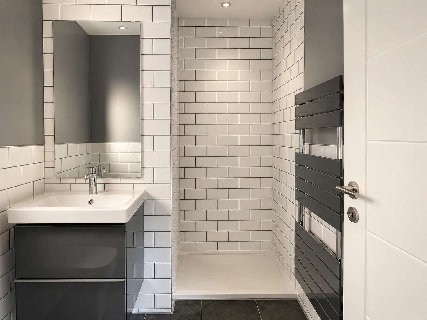 Modern bathroom with vanity, large mirror, white subway tile shower, and black towel rack