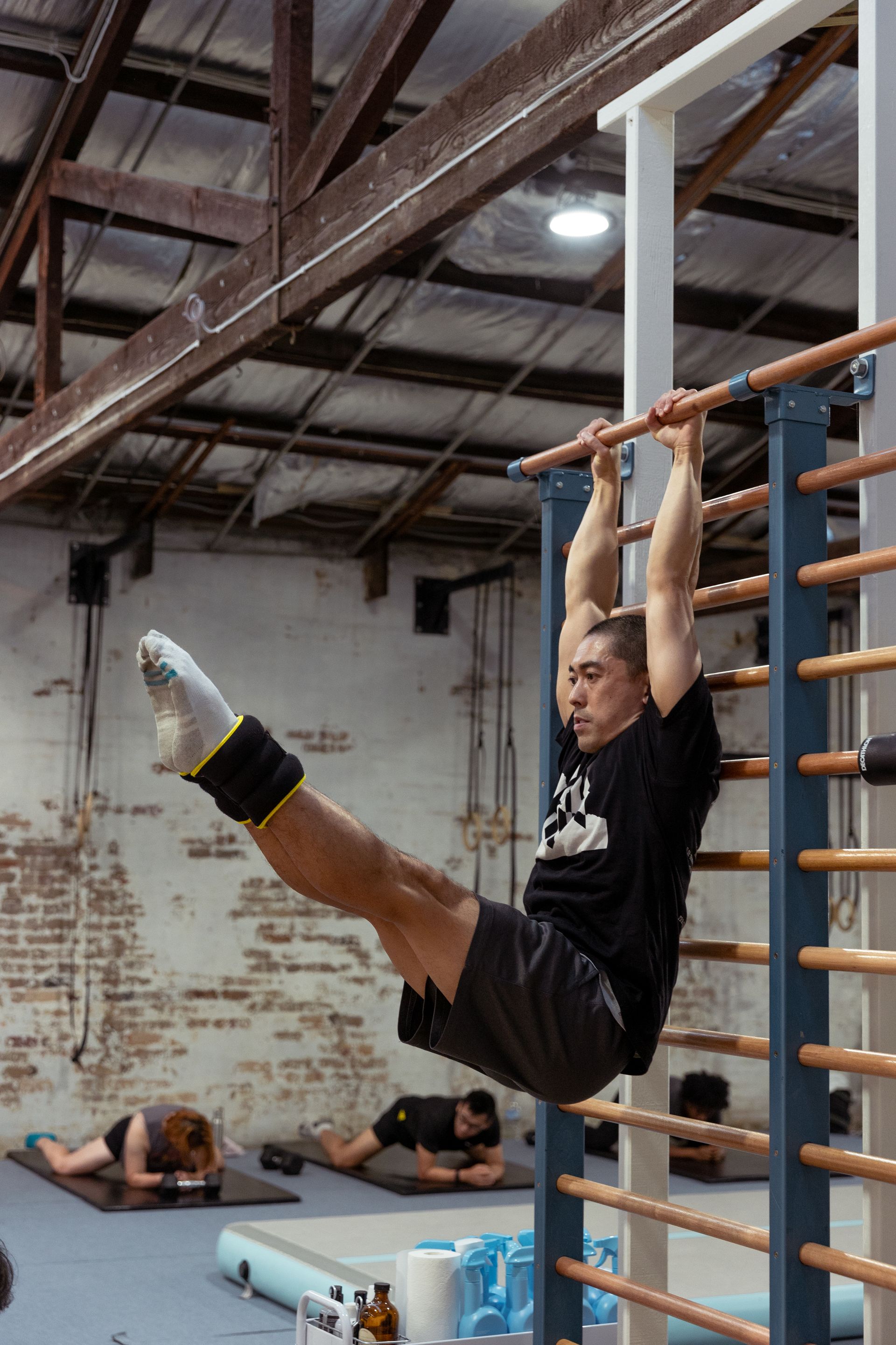 Image of a guy showing doing a L situp