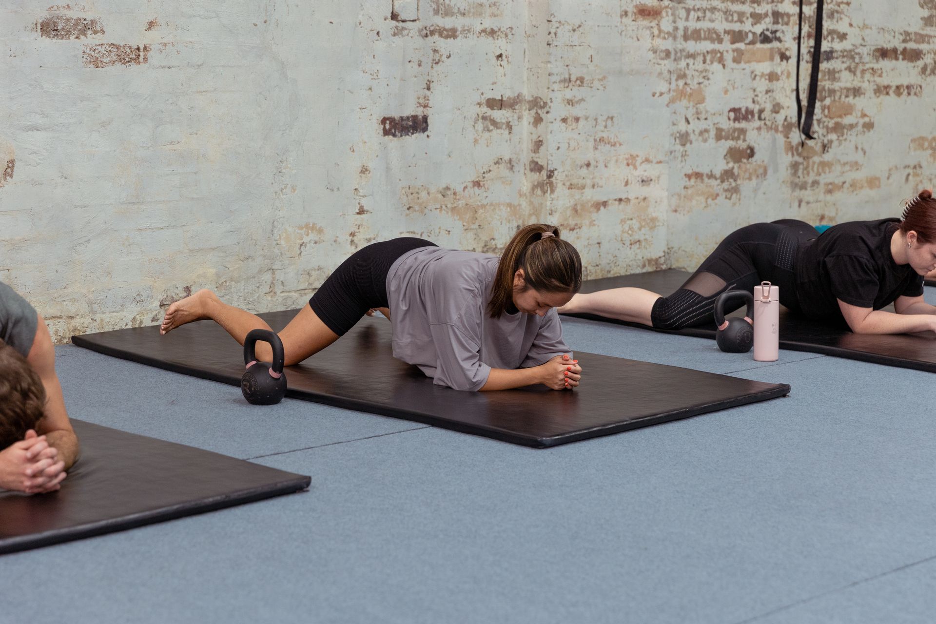 Image of people stretching in the gym
