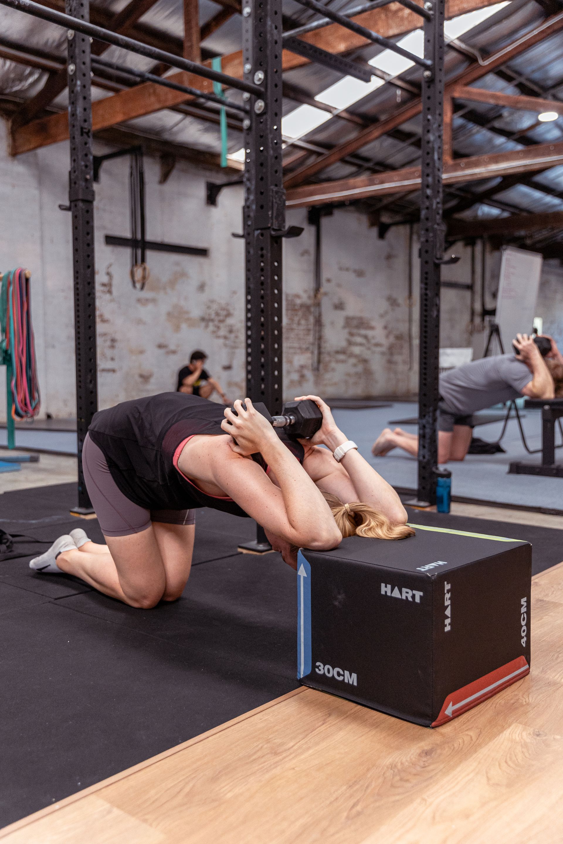 Image of people stretching in the gym