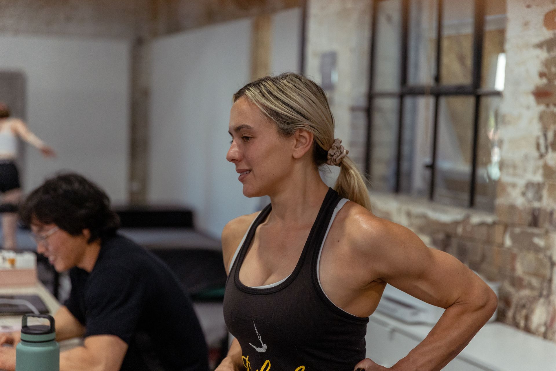 Image of a girl posing for a picture in a gym
