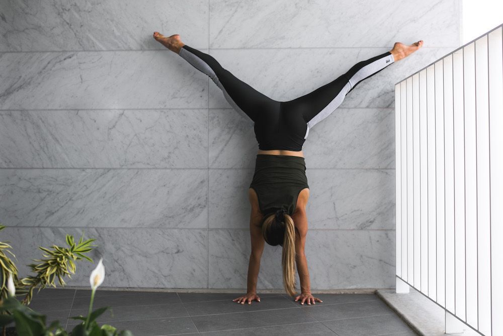 Image of a girl doing a handstand