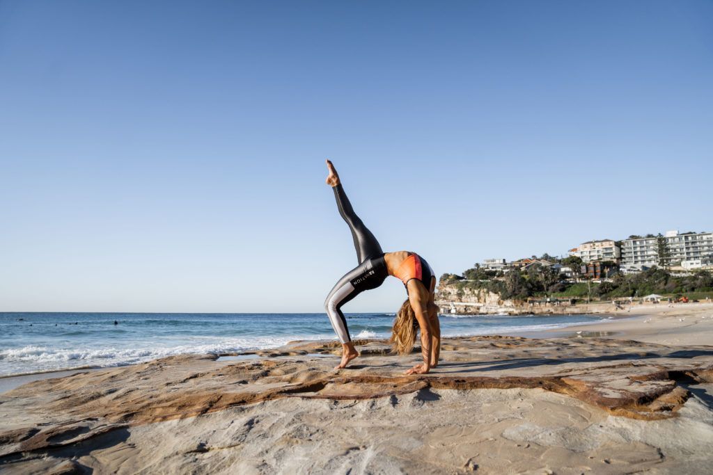 Image of a girl working out near the ocean