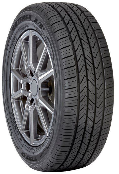 A black car tire with a silver rim, featuring a patterned tread.