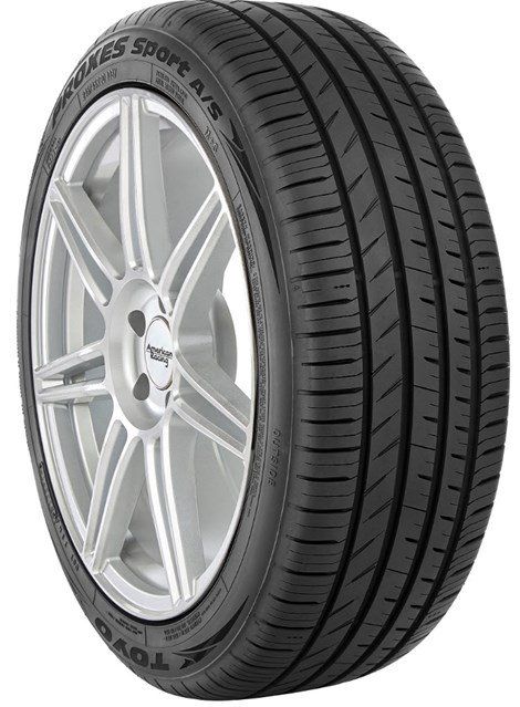 Black tire with tread on a silver rim;